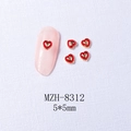Macro detail of red heart nail art charm with gold beaded edges on pink manicure - 8312 Gold Border Red Heart (5*5mm)