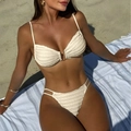 Detail of cream ribbed bikini set featuring a gold U-shaped metal buckle on the beach - S / Apricot