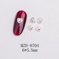 Macro detail of silver heart nail charms with AB rhinestones and size 6x5.5mm labels - Silver Heart Large Aurora Rhinestone Style(8704)