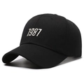 Classic black cotton baseball cap with 1987 embroidery and curved visor style - One Size / Black with White Embroidery