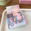 Close-up of colorful baby-sized elastic hair ties in a Cereal Box packaging display - 40 Pcs/Box / Mixed Colors Type 2