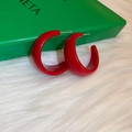 Detail shot of chunky red C-shaped hoop earrings with gold metal needles on plush fabric - Full C-Shape Style (5#)