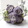 Detail of purple artificial peony bouquet with gradient petals and realistic green leaves - Violet