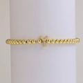 Gold beaded elastic bracelet with micro-pave letter Y charm and polished 18k finish - Letter Y
