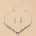Macro detail of bridal jewelry set with green rhinestones on silver necklace and earrings - Apple Green-Two-piece set