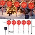 5-pack solar Christmas pathway lights with red Santa Stop Here candy cane stakes - Battery Box / Octagonal Sign