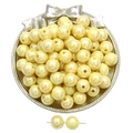 Lustrous yellow acrylic round beads on a silver decorative tray for DIY jewelry making - Yellow
