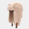 Detail of beige fleece trapper hat with thick plush texture and brown leather straps - M (56-58cm) / Off White