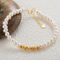 Macro shot of S925 sterling silver beads and natural freshwater pearls on a golden bracelet - Natural Pearl Silver Bracelet (Gold)