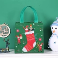 Green non-woven Christmas gift bag with nutcracker and holiday motifs for shopping - Green Stockings