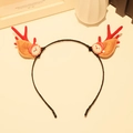 Christmas headband featuring red reindeer antlers and Santa Claus decor on white desk - Headband 2# (Single)