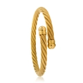 Close-up of the woven texture and polished sphere ends on a golden cable cuff bracelet - Gold