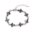 Silver cross bracelet with natural abalone shell inlays and adjustable chain on white - Cross Style
