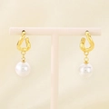 Detailed shot of gold-plated twisted hoop earrings with elegant pearl drop charms - Gold Twisted Ring (KE115799-GC)