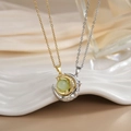 Macro view of gold and silver moon necklaces with cat eye stones and cubic zirconia - Gold Silver Light Green Cat Eye Moon XL0284GB