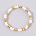 Minimalist beaded ring with white spherical beads and golden cylindrical accents - Creamy White and Gold