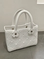 White EVA tote bag with geometric 3D pattern and decorative floral rivets for beach wear - Off White