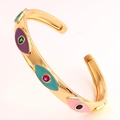 Macro view of C-shape cuff with colorful enamel evil eye patterns and inset gemstones - Purple Lake Blue Enamel Style (SL99-5)