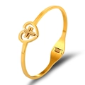 Polished gold stainless steel bangle with a heart-shaped cross charm design - Heart Cross Style / Gold
