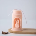 Peach-pink pillar candle with embossed couple design and white ribbon decoration - Hugging (Light Pink)