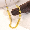 Detail of a gold necklace with yellow leaf accents displayed on natural wood over white sand - Geometric Leaf Style (BY020)