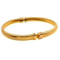 Detailed shot of gold-plated bangle featuring ribbed texture and crystal screw detail - Gold Choker (YS782)