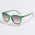 Detail of green transparent frame sunglasses with gradient purple to yellow lenses - Transparent Green with Grey Brown Lenses