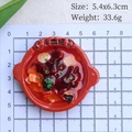 Top-down view of a miniature Mao Xue Wang food fridge magnet on a grid measuring paper - Spicy Mao Xue Wang (No Magnet)