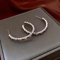 Close-up of silver hexagonal link hoop earrings with clear rhinestones on a jewelry box - 1# Silver Earring Post - Silver / Silver Hexagon Zircon Style