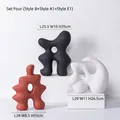 Three-piece modern ceramic abstract sculptures in black, white, and terracotta matte finish - Artificial Rockery Ornament Set 4