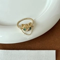 Adjustable golden ring featuring a green-eyed cat motif on a rope textured band - Green Gem Cat Head (J3967)