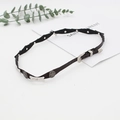 Detail of a black leather punk choker with silver metal stars and vintage engraved buckle - Black Star Stud Buckle Style (5)