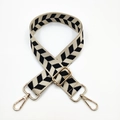 Detail of adjustable black and white geometric knit strap with gold metal swivel hooks - Rice Black