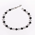 Detailed macro view of square black and white zircon stone spacer beads for DIY jewelry - 4mm Black White White Gold