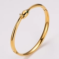 Snake-shaped gold-plated stainless steel bracelet with green enamel eyes and hinge - Green Eyes