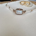 Elegant rose gold oval watch with double-row pearl strap and mother-of-pearl dial face - White Dial Rose Gold Case