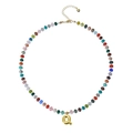 Bohemian beaded necklace featuring colorful gemstones and a golden bubble letter Q pendant - Letter Q