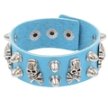 Detail of blue PU leather cuff featuring silver skull charms and punk-style metal spikes - Sky Blue Skull