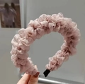 Close-up of pink pleated chiffon sponge headband with delicate floral texture and ruffled edge - Pink