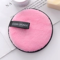 Pink microfiber makeup remover puff with black trim and ribbon handle for face cleaning - Pink