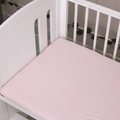Soft pink fitted cotton crib sheet for infant mattresses in a white wooden baby bed - Pink / 100*56cm