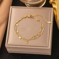 Double-layered stainless steel star necklace with gold finish on jewelry box - Starry Glass Bead Style (B5066)