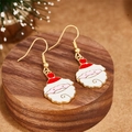 Festive Santa Claus enamel drop earrings with gold hooks on a wooden display - Santa Claus Head Style (E00897G)