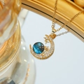 Golden crescent moon necklace featuring a blue galaxy sphere and zircon stones - Star and Moon Galaxy Style (C398 Gold) / Gold