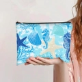 Détail de la trousse de maquillage en toile avec imprimés hippocampe et étoile de mer - Style Hippocampe Bleu Roi (jiaying0086)