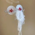 Detailed view of resin flower earrings with silver wire, red beads and white tassels - White Disc Red Berry White Tassel (19# Silver Earring Post)