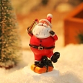 Miniature Santa Claus figurine with gift bag on a snowy base for Christmas decor - Santa Claus with Suitcase