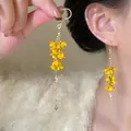 Detail of yellow acrylic floral dangle earrings with long golden tassel and micro beads - Yellow Stereo Petal Gold Chain Ear Hook (24#)