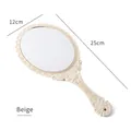 Specchio a mano beige vintage con motivi floreali a rilievo e decorazione a fiocco - Beige