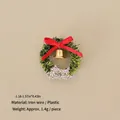 Miniature Christmas wreath with golden bell, red bow, and Merry Christmas sign - No.77 - Mini Wreath with Silver Greeting